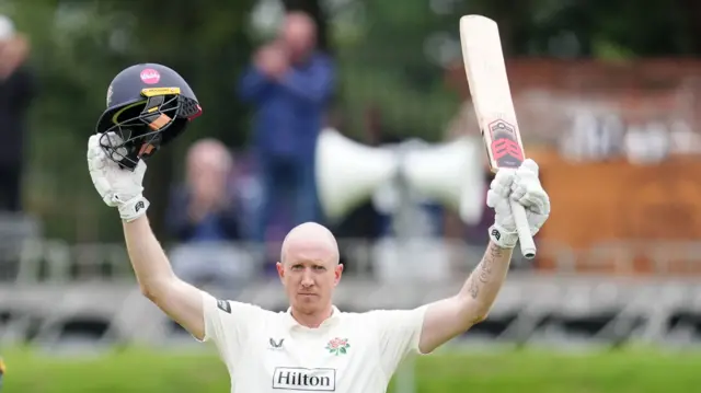 Lancashire's Luke Wells celebrates his century against Kent