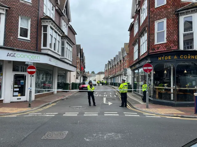Police guard a cordoned off street