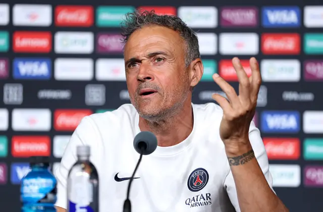 Luis Enrique gesturing with his hand at the news conference
