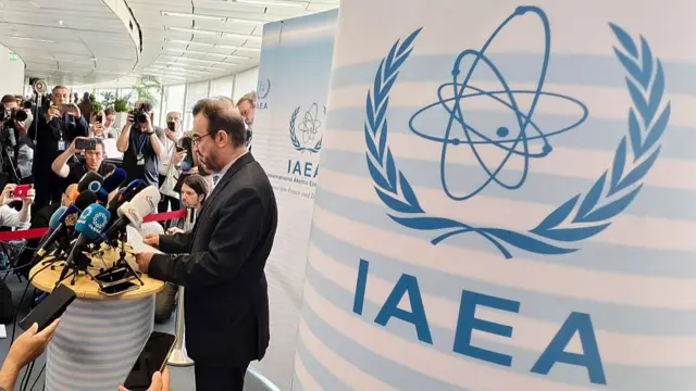 Reza Najafi, Iran's ambassador to the International Atomic Energy Agency (IAEA), speaks to journalists shortly after an extraordinary IAEA's Board of Governors meeting at the agency's headquarters in Vienna