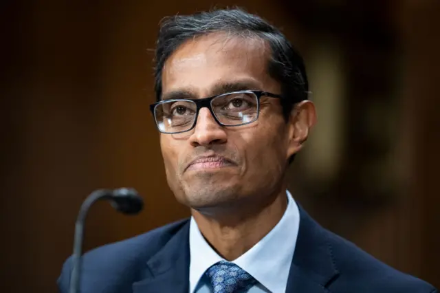 Arun Subramanian testifies during his Senate Judiciary Committee confirmation in 2022. He is wearing a blue suit and eye glasses.