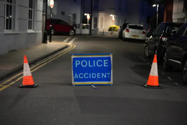 A sign says police accident.