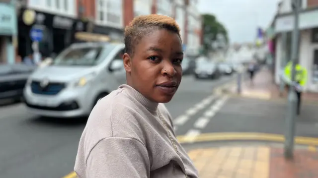 Close up image of Kudzi Muringani on a street