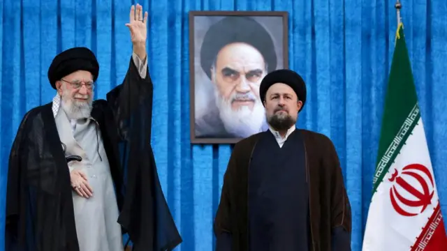 Ayatollah Ruhollah Khomeini's grandson, Hassan Khomeini stands next to Iran's Supreme Leader Ayatollah Ali Khamenei in southern Tehran, Iran on 4 June 2025.