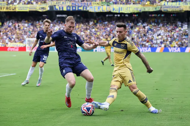 Agustin Marchesin #25 of CA Boca Juniors battles for possession with Dylan Connolly #19 of Auckland City FC