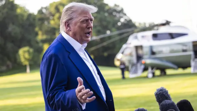 US President Donald Trump speaks to the media as he departs the White House for the NATO leaders summit, in Washington, DC