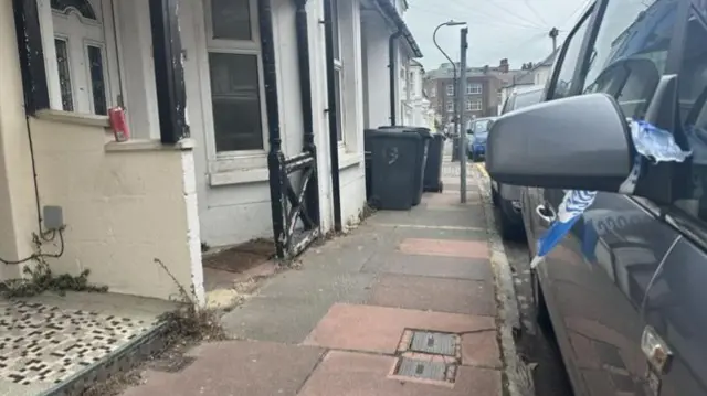 A street in Eastbourne with remains of police cordon