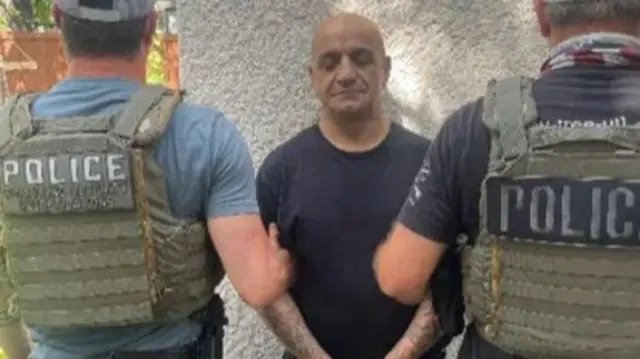 Police detaining a man