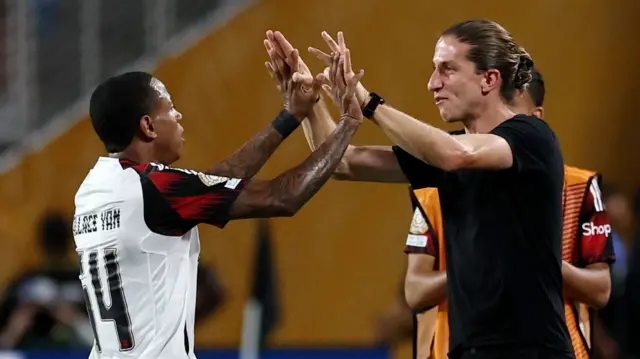 Wallace Yan celebrates scoring for Flamengo against Los Angeles FC with their coach Filipe Luis