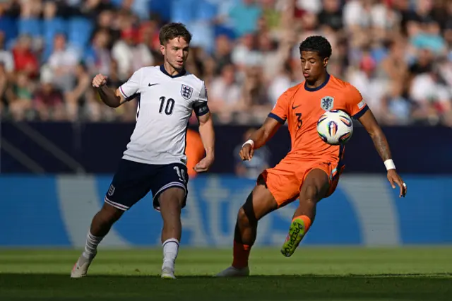 James Mcatee of England passes the ball whilst under pressure from Devyne Rensch
