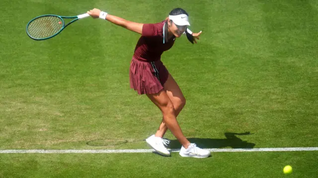 Emma Raducanu plays a shot