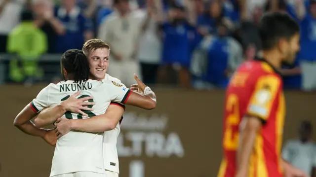 Liam Delap is hugged by Christopher Nkunku after scoring for Chelsea against ES Tunis