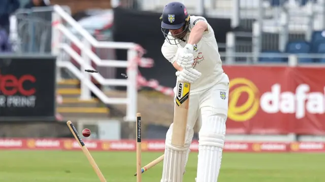 Durham's Colin Ackermann is bowled against Durham
