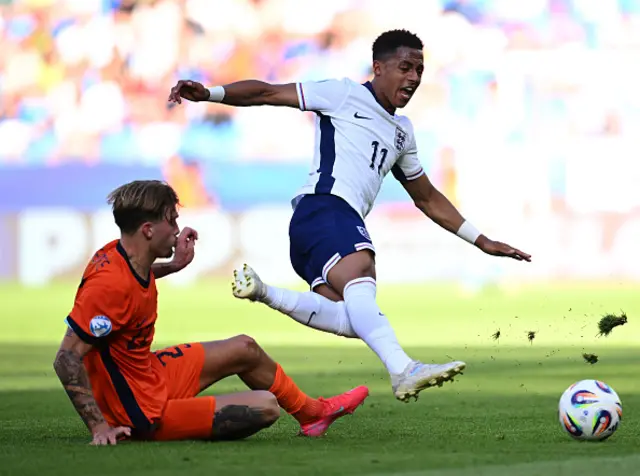 Omari Giraud-Hutchinson of England is challenged by Luciano Valente