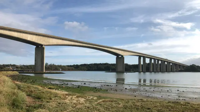 The Orwell Bridge over the River Orwell on a sunny day.