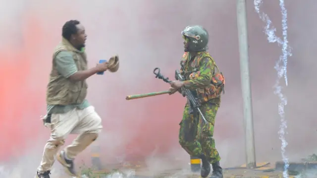 Protester running away from a police officer