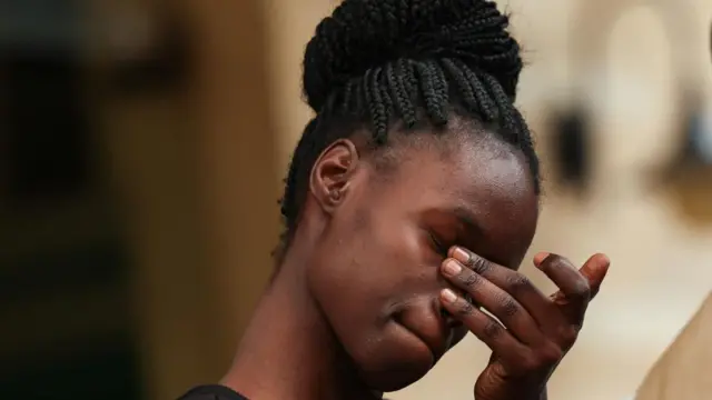Nevnina Onyango, the widow of Kenyan blogger Albert Ojwang who died in police custody,wipes tears from her eyes after giving a statement to the Independent Policing Oversight Authority (IPOA), in Nairobi, Kenya, June 13, 2025