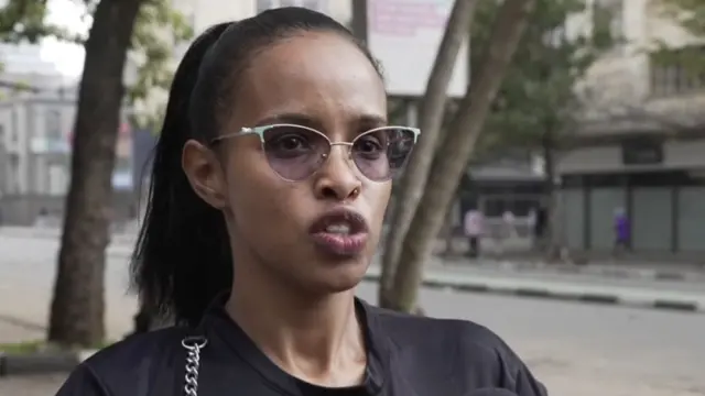 A woman in a black T-shirt