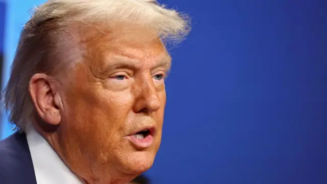 A photo of Trump speaking at the news conference