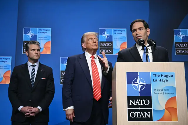 US Secretary of State Marco Rubio (R) speaks flanked by US President Donald Trump (C) and US Defense Secretary Pete Hegseth (L) at a press conference