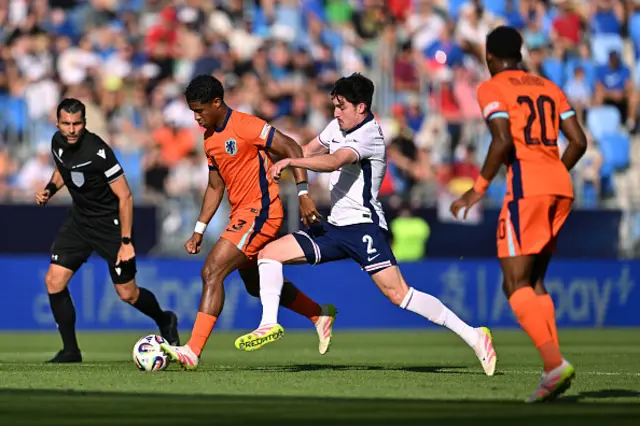 Ryan Flamingo of the Netherlands is challenged by Tino Livramento