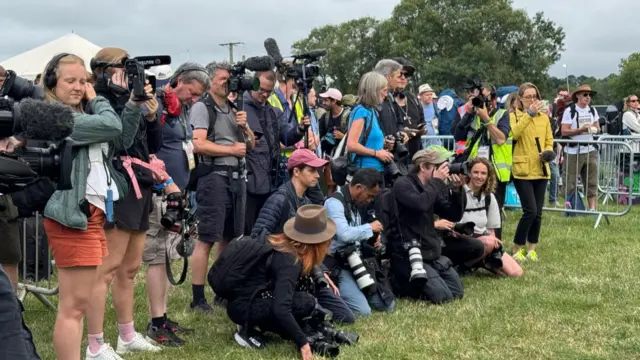 Media eagerly awaiting Michal and Emily Eavis to appear to open the gates