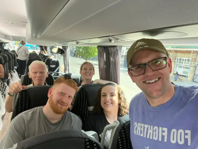 Richard and family on a coach