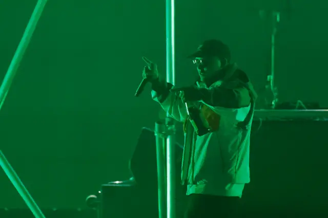 Kneecap rapper Liam Óg Ó hAnnaidh performing on stage