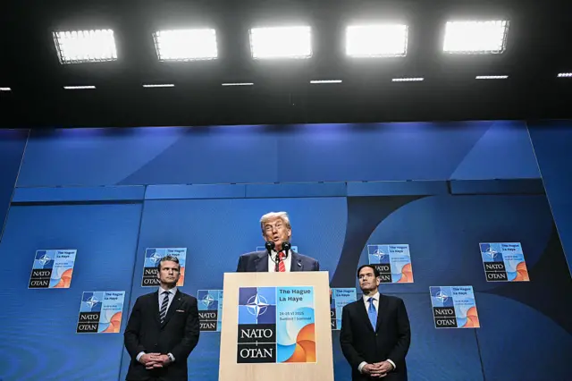US President Donald Trump (C) speaks flanked by US Defense Secretary Pete Hegseth (L) and US Secretary of State Marco Rubio