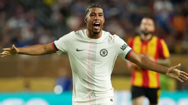 Andrey Santos with his arms out while playing for Chelsea against ES Tunis