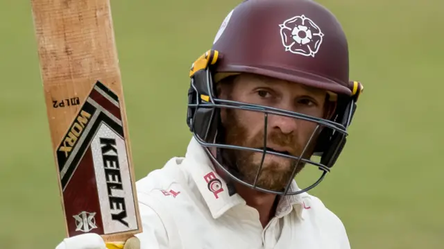Luke Procter celebrates reaching fifty