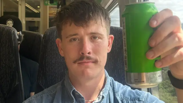 Connor on a train