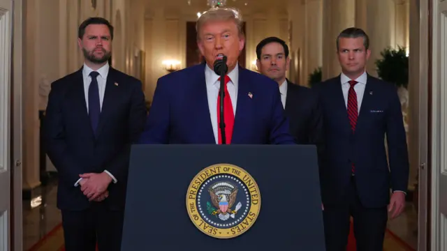 Donald Trump making announcement at lectern about nuclear strikes on Iran