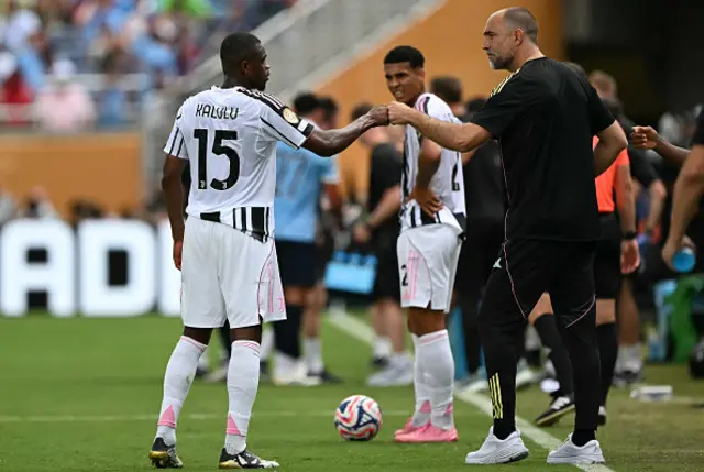 Pierre Kalulu is greeted by his Croatian head coach Igor Tudor