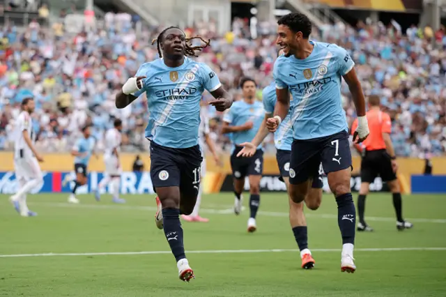Jeremy Doku #11 of Manchester City celebrates