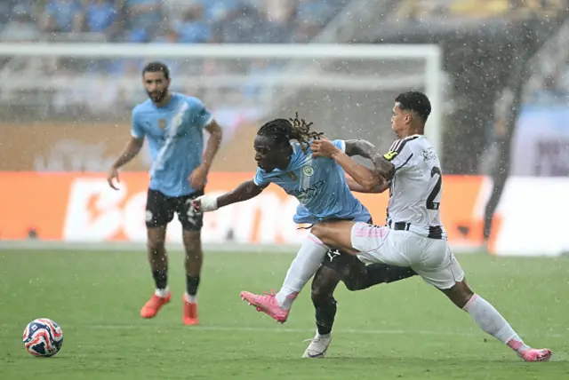 Jeremy Doku and Juventus Portuguese defender #02 Alberto Costa fight for the ball