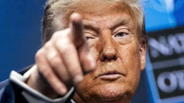US President Donald J. Trump speaks during a press conference after the NATO Summit