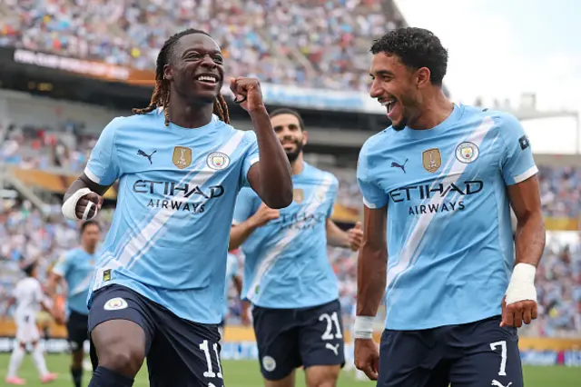 Jeremy Doku #11 of Manchester City celebrates with Marmoush Omar