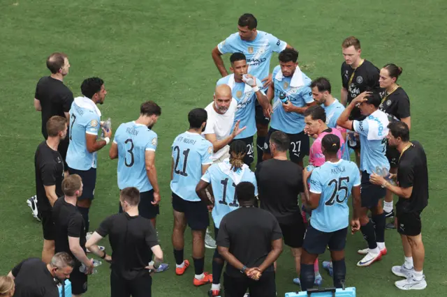 Pep Guardiola giving his squad a team talk