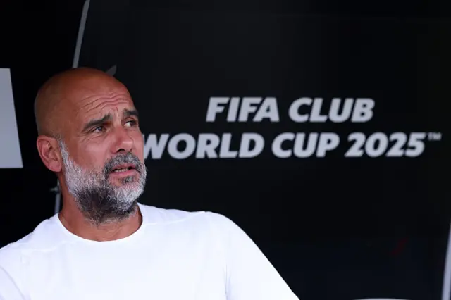 Pep Guardiola looks on