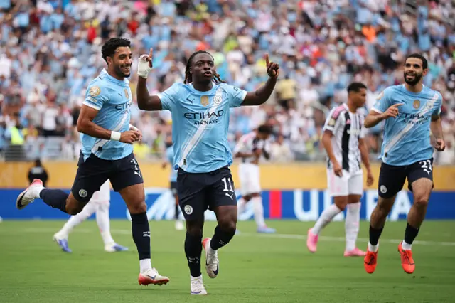 Jeremy Doku #11 of Manchester City celebrates