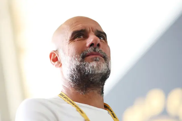 Pep Guardiola looks on