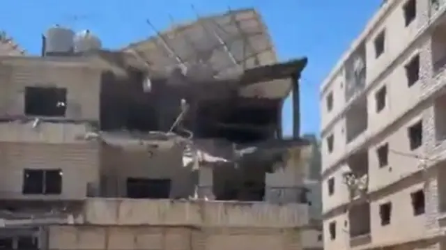 This screengrab from a verified video shows a badly damaged apartment building in Nabatieh