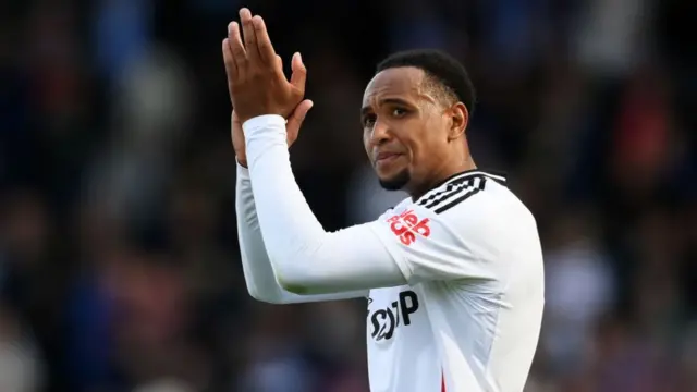 Kenny Tete of Fulham applauds the fans