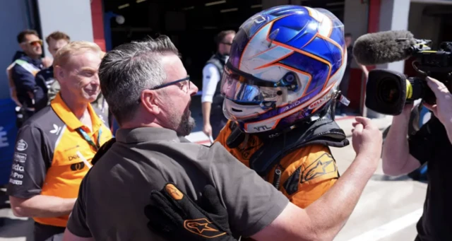 Alex Dunne hugs his father, Noel