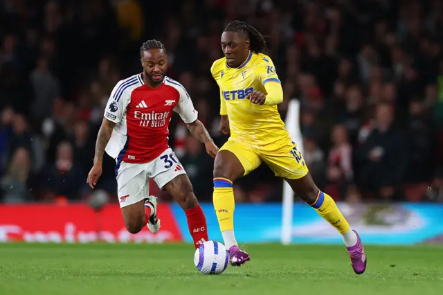 Eberechi Eze of Crystal Palace under pressure from Raheem Sterling of Arsenal