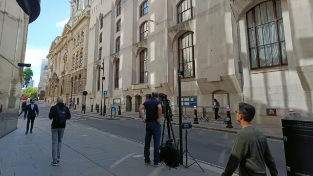 Reporters and camera crews set up outside the Old Bailey
