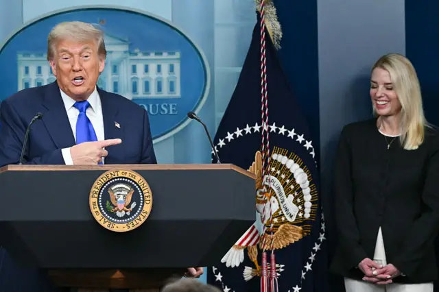 President Donald Trump speaks alongside Attorney General Pam Bondi(Right)