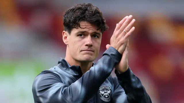 Christian Norgaard applauds the Brentford fans