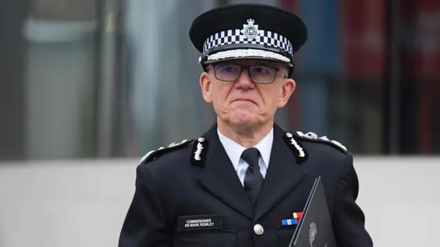 Metropolitan Police Commissioner Sir Mark Rowley wears a dark uniform with epaulets showing his rank.